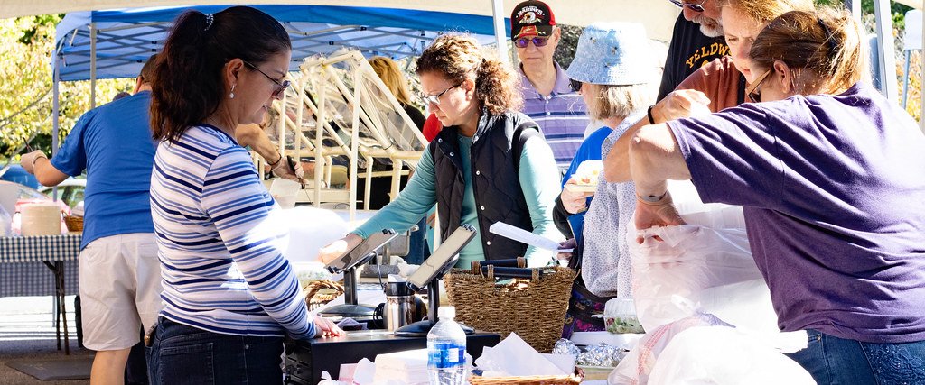 Volunteers preparing and packing food at the Greek Festival.