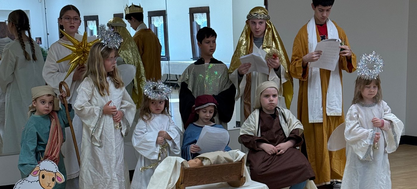 Sunday School children in costume performing the nativity play in the Fellowship Hall.